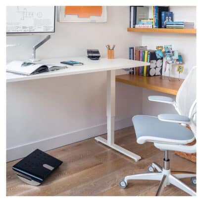 A Humanscale Float height-adjustable standing desk, designed to promote movement and improve health at work.