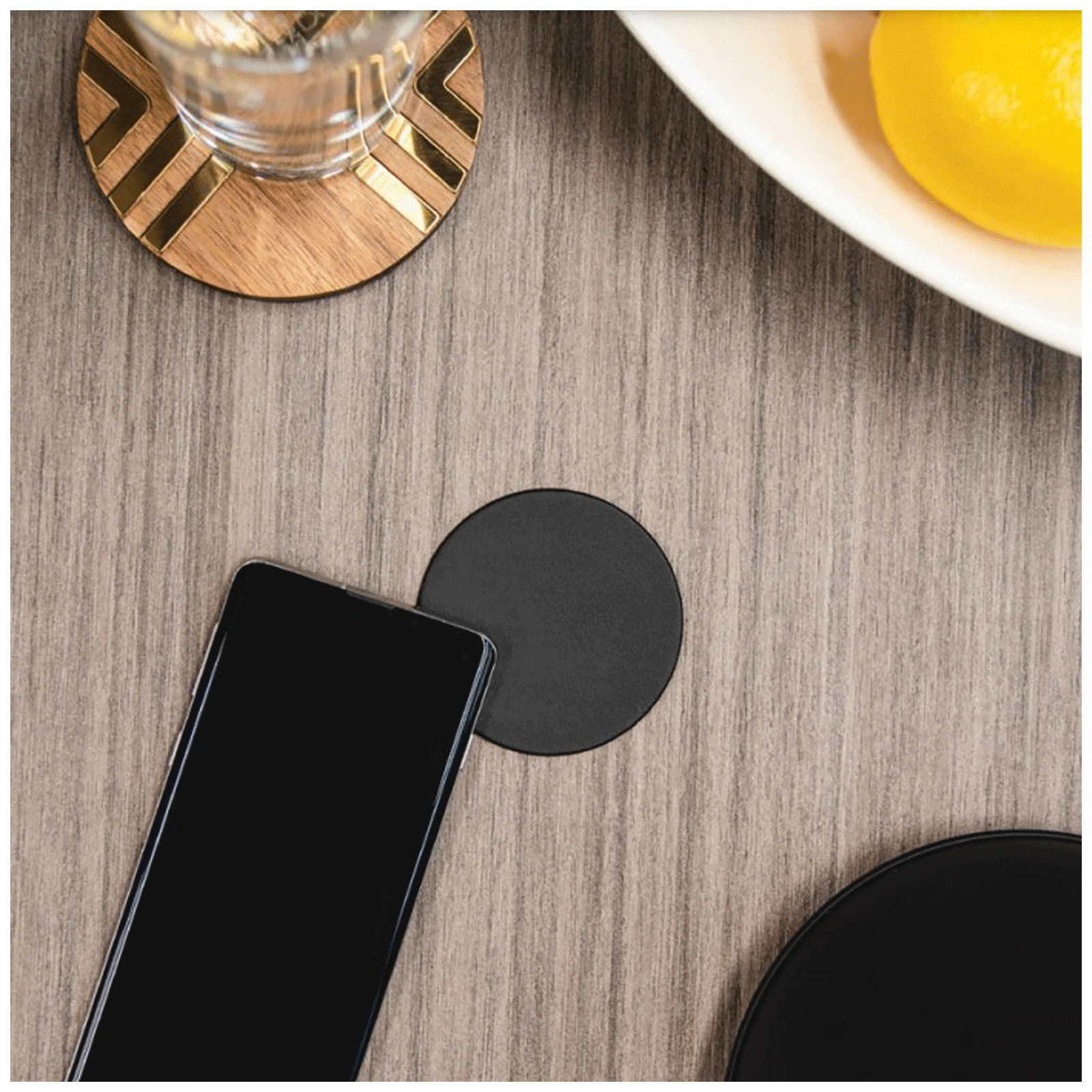 A Qi-compatible wireless charging pad that can charge a variety of devices, including smart phones, tablets, and smart watches