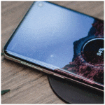 A Qi-compatible wireless charging pad that can charge a variety of devices, including smartphones, tablets, and smartwatches