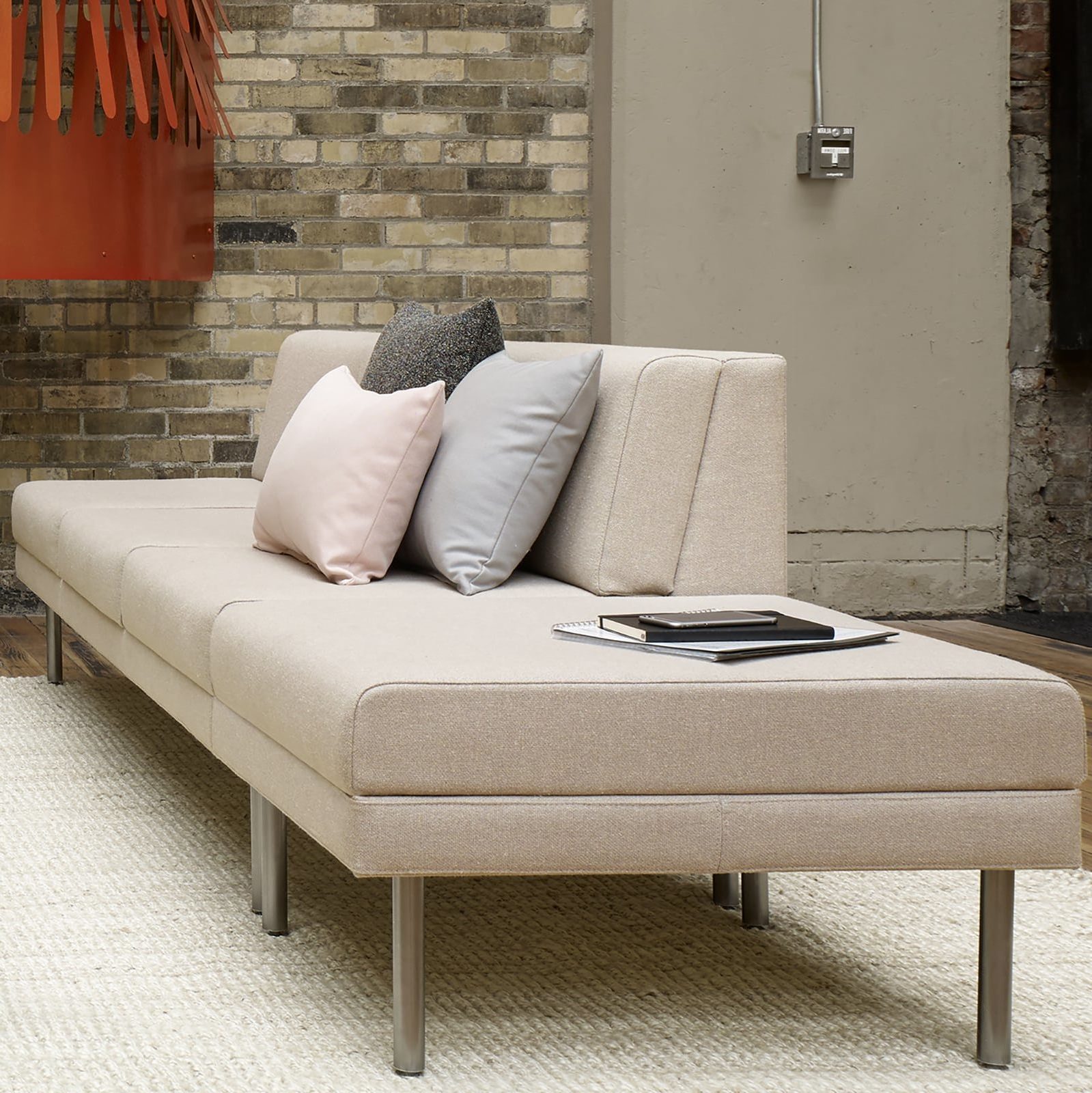 Source International Lore Armless Sofa in creamy Fabric